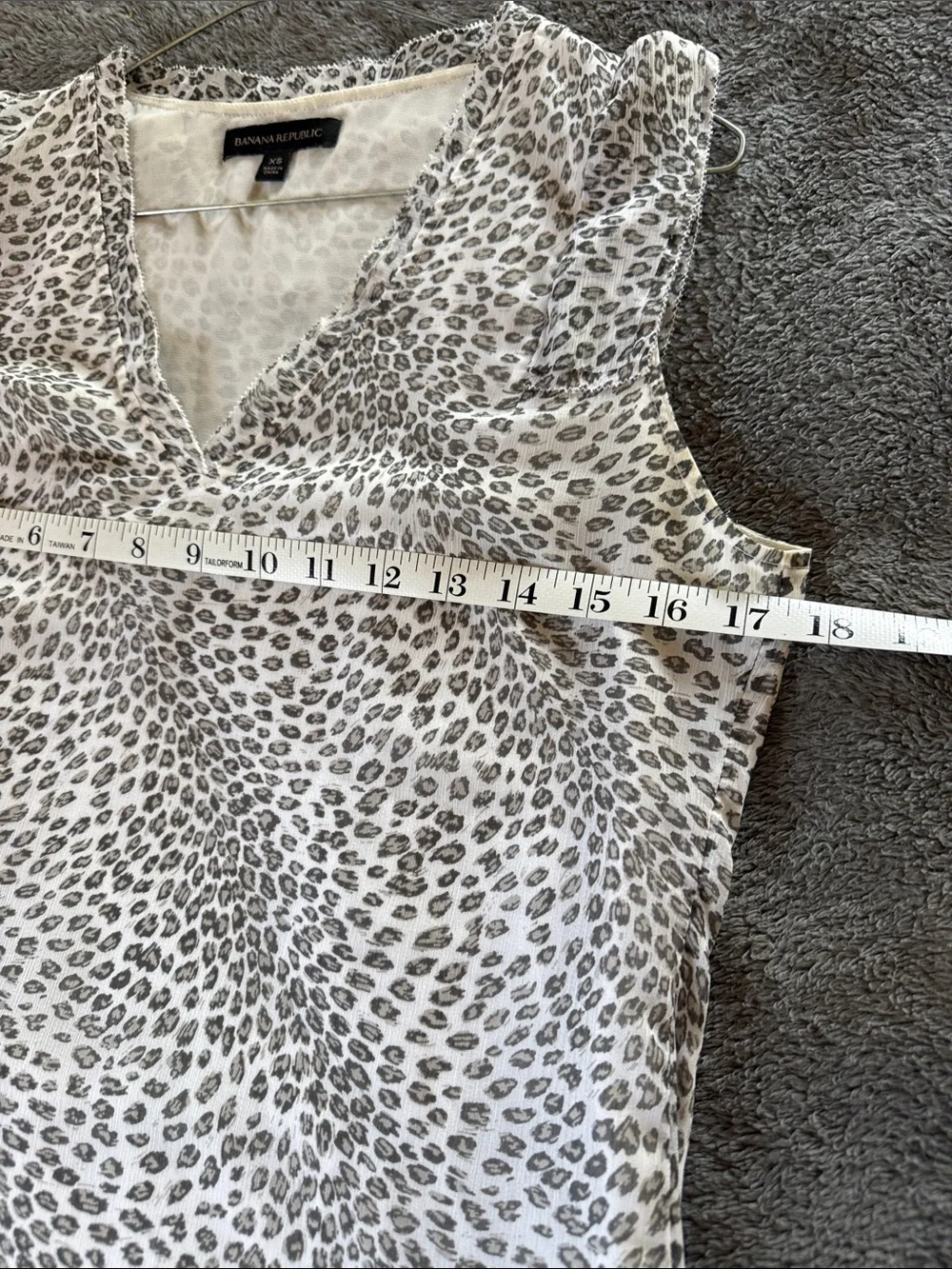 Two Banana Republic sleeveless blouses.